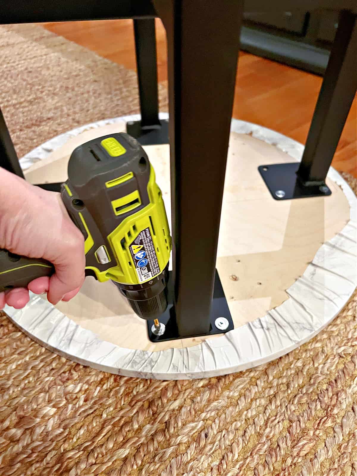 Attaching iron legs to DIY coffee table with drill