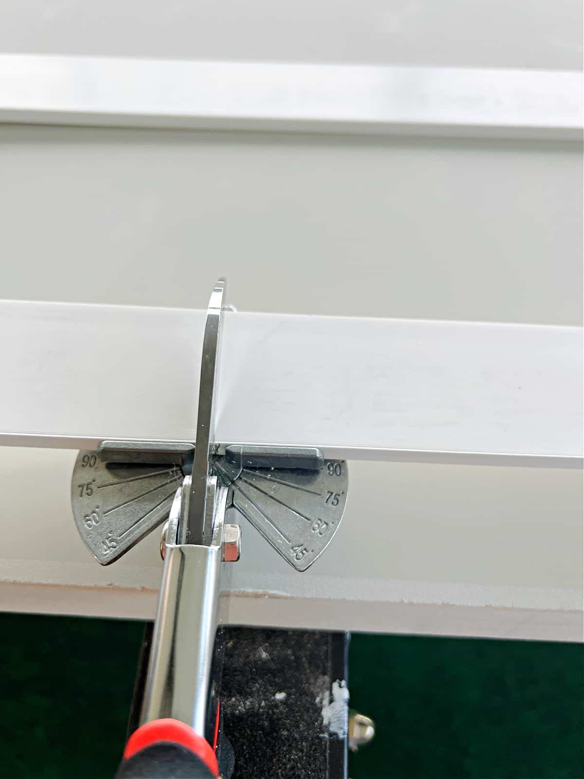 using tool to cut PVC strip 