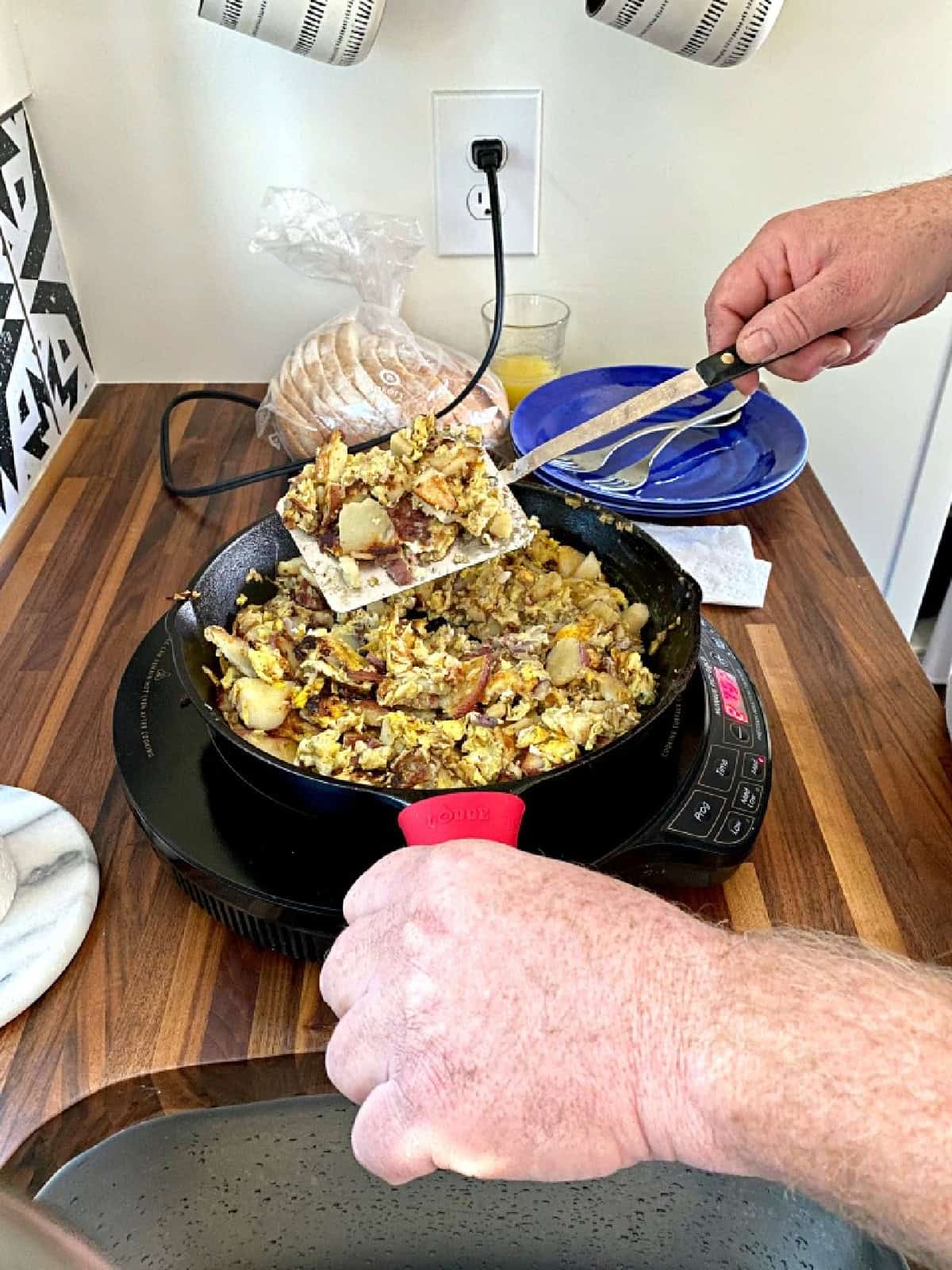flipping eggs in a camping breakfast skillet