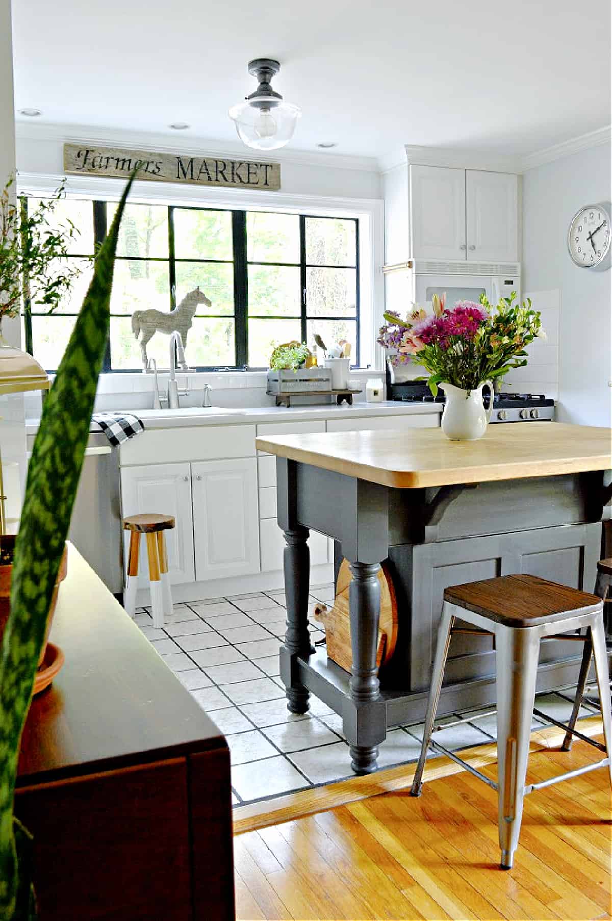 gray kitchen  island and white kitchen cabinets