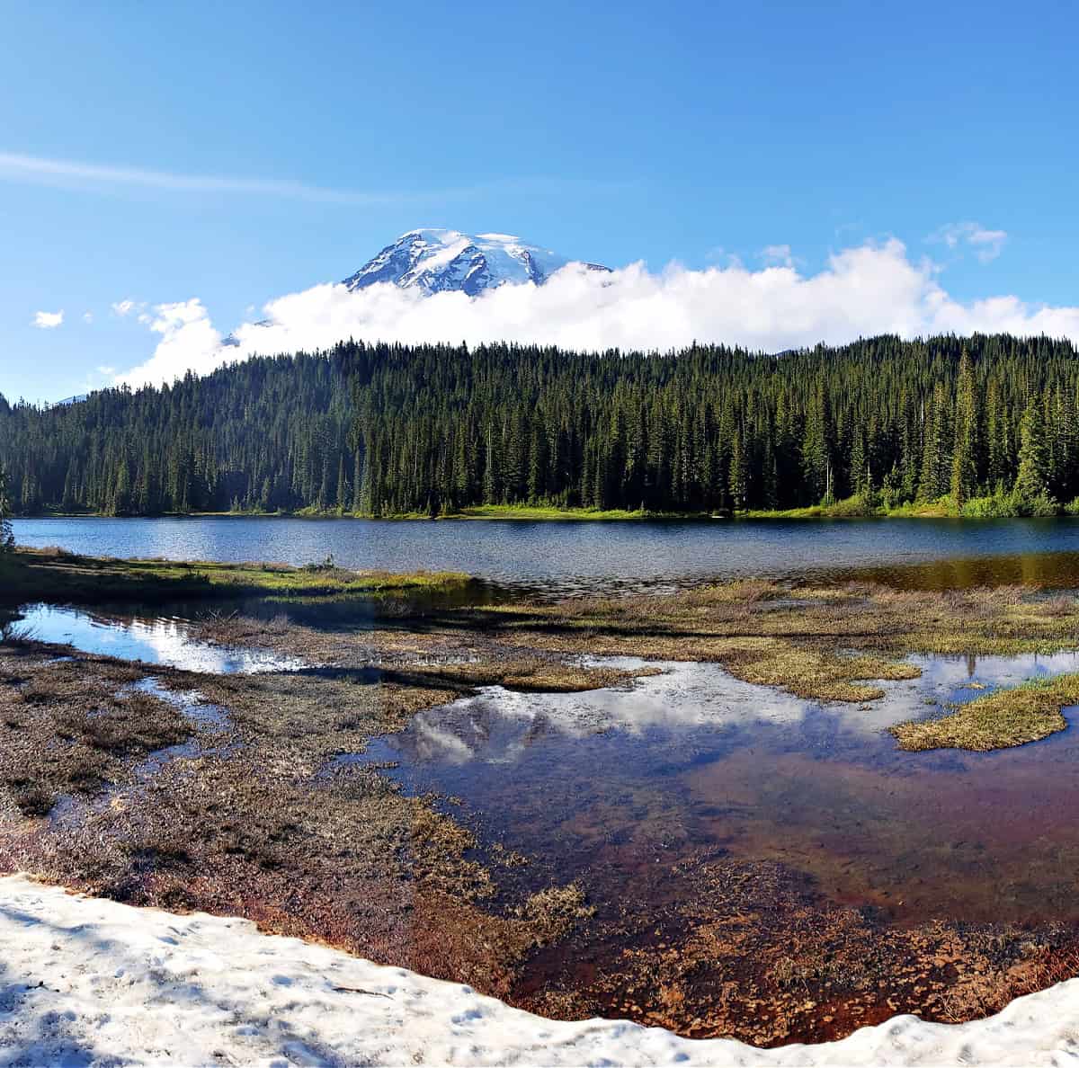reflection of mount rainier peak in reflection lake