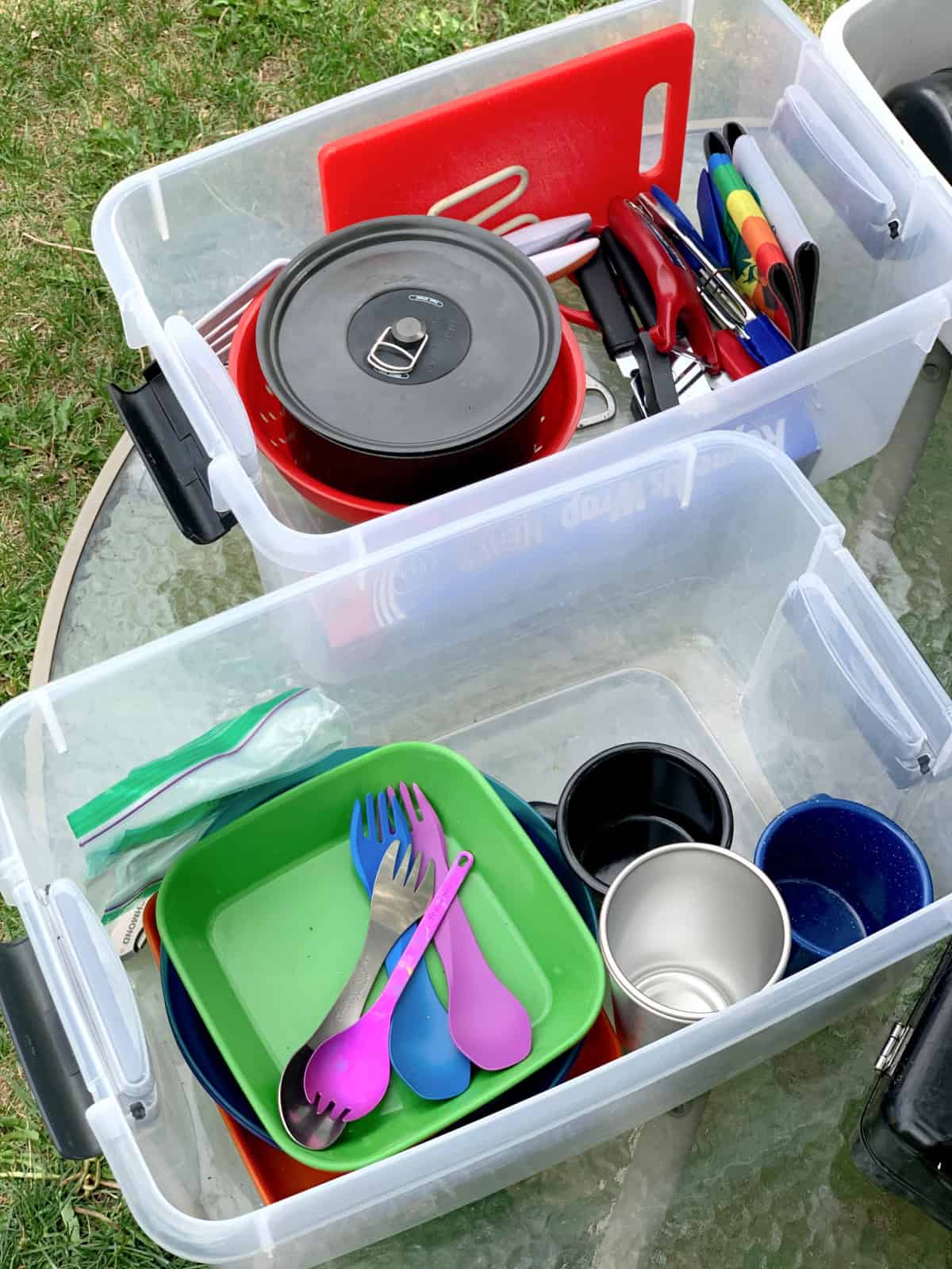 Camp Kitchen Gear & Packing List kitchen gear in clear storage bins