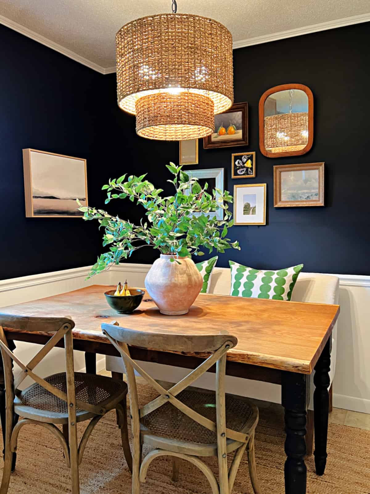 black painted walls in tiny dining nook with table