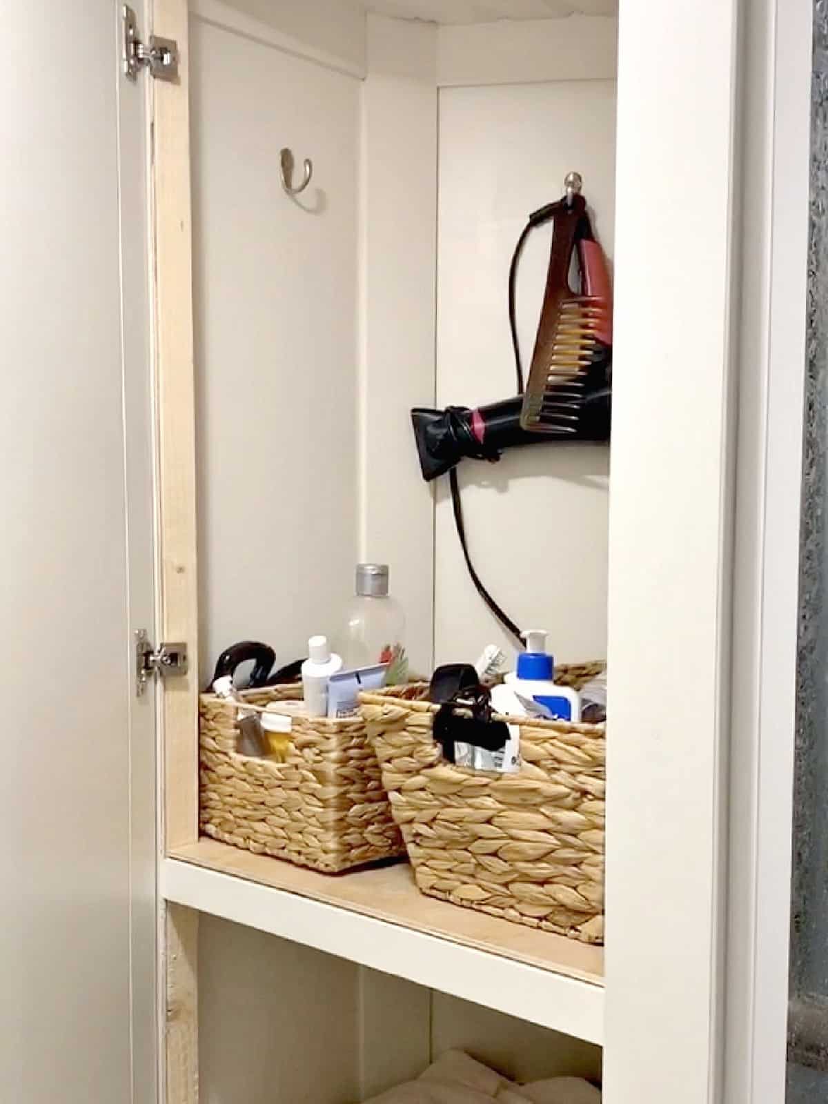 RV Camping Storage Ideas for Better Organization pix woven baskets in RV linen closet used for toiletry organization