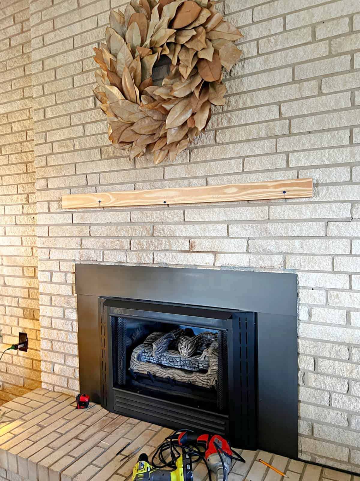 half of french cleat attached to fireplace