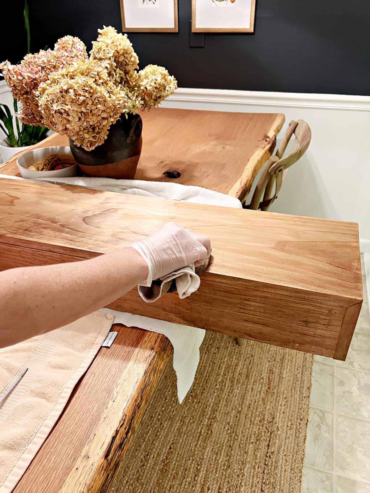 applying stain to wood mantel shelf