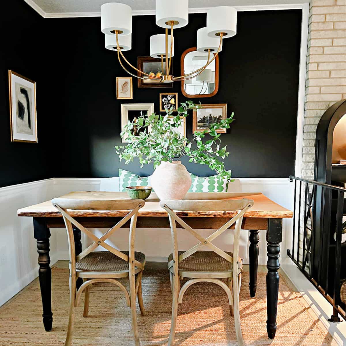 small breakfast nook wth black painted walls