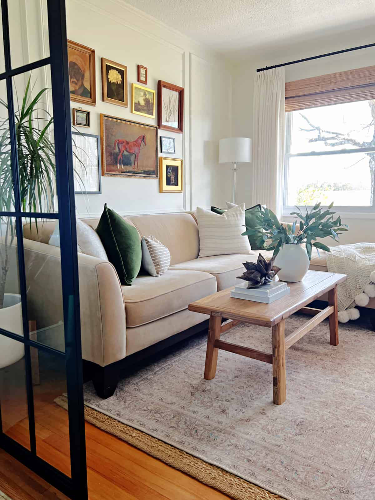 neutral sofa and gallery wall in small living room