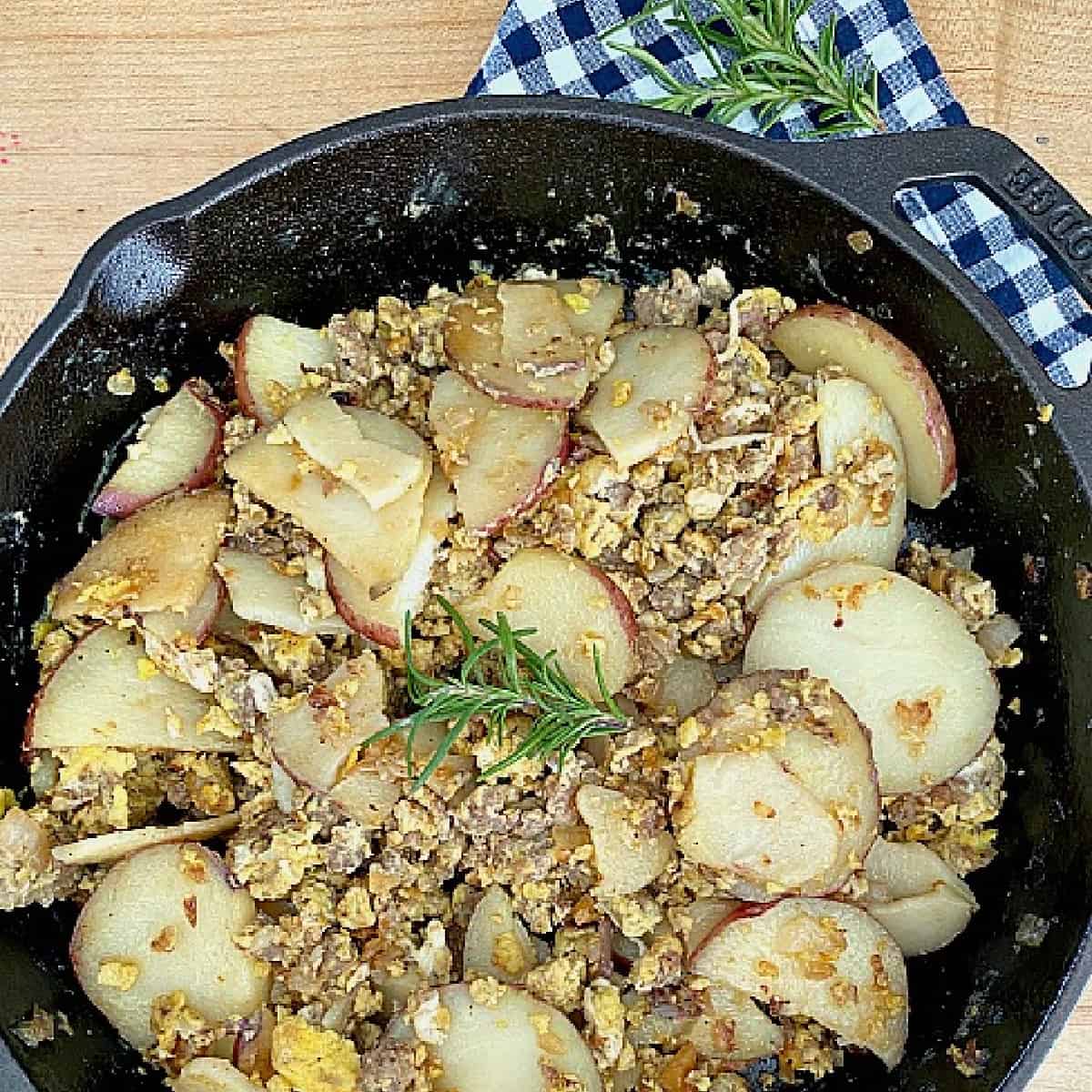 breakfast skillet with eggs, potatoes and sausage