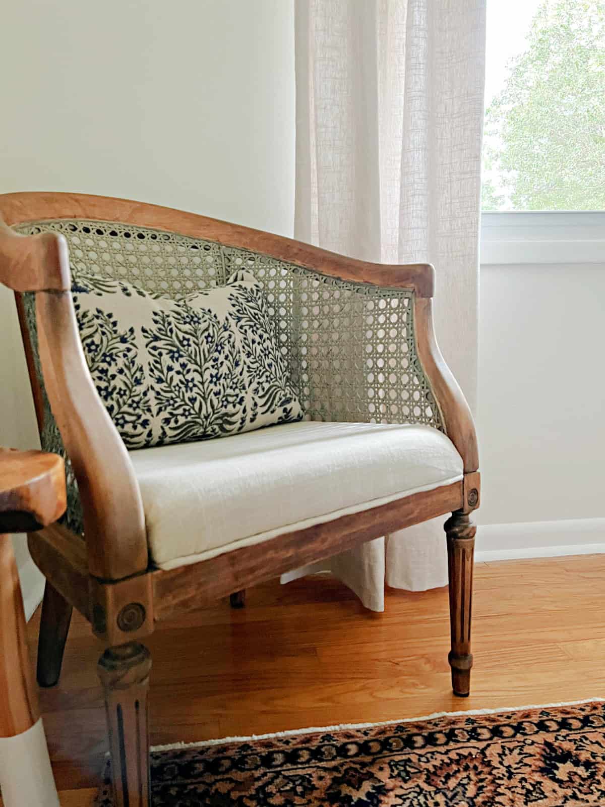 vintage chair in corner of guest bedroom