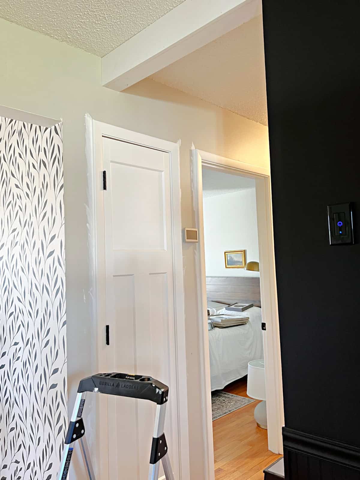 ceiling beam installed between hallway and kitchen