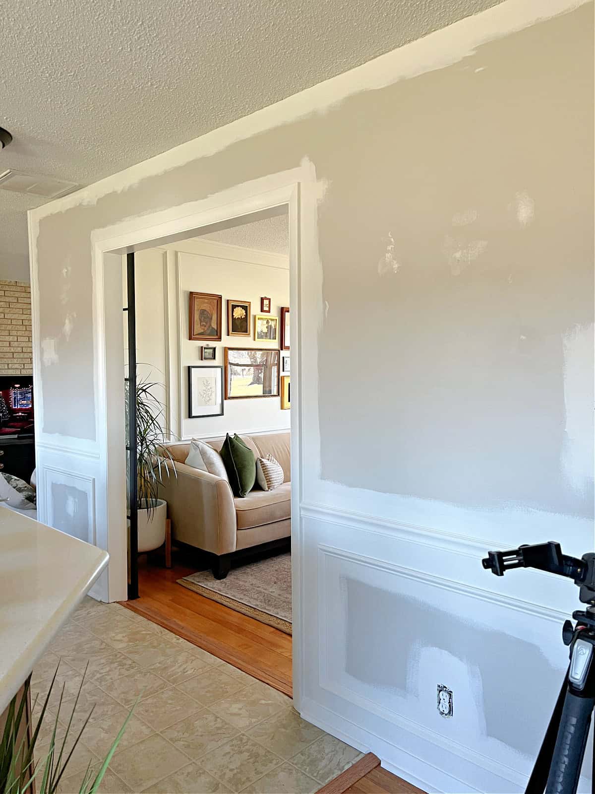 walls in hallway with new trim and some painnt