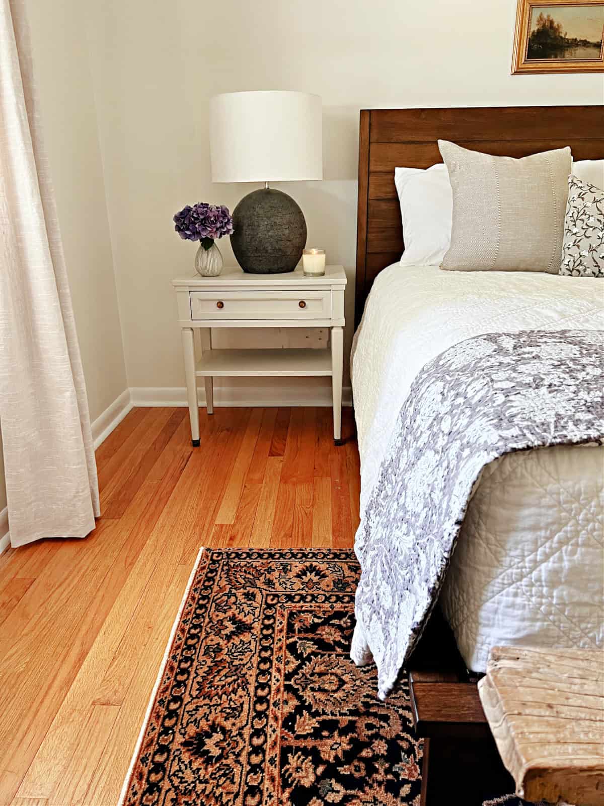 nightstand next to guest bedroom bed