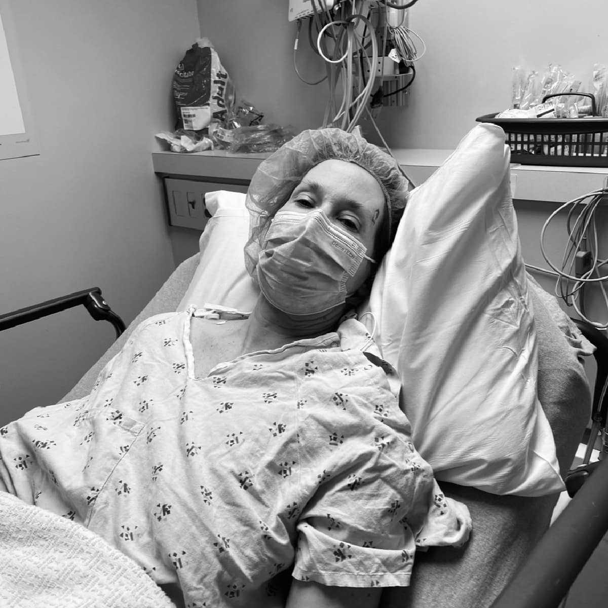 person laying on hospital bed.