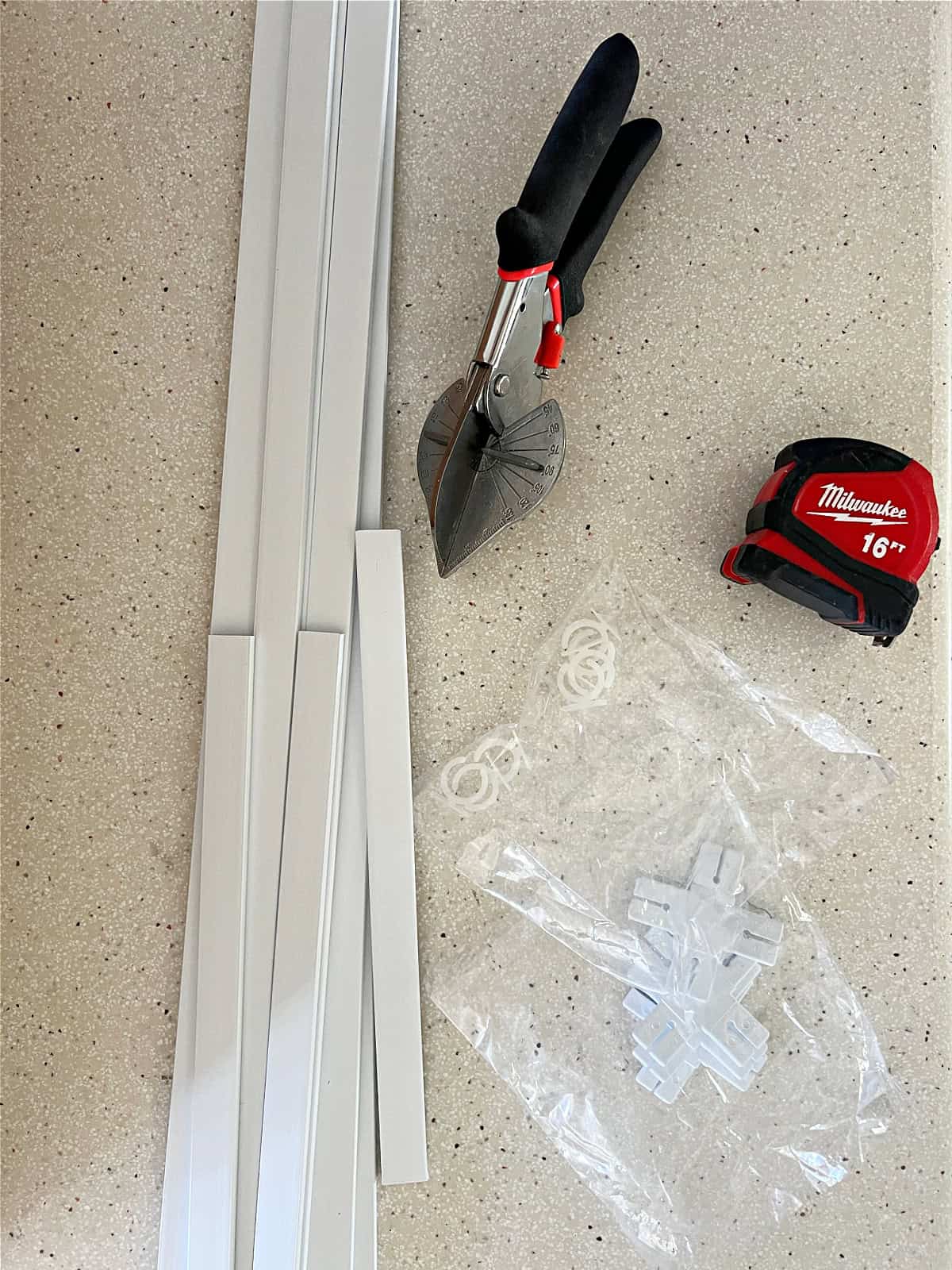 PVC window mullion kit with tape measure and clippers