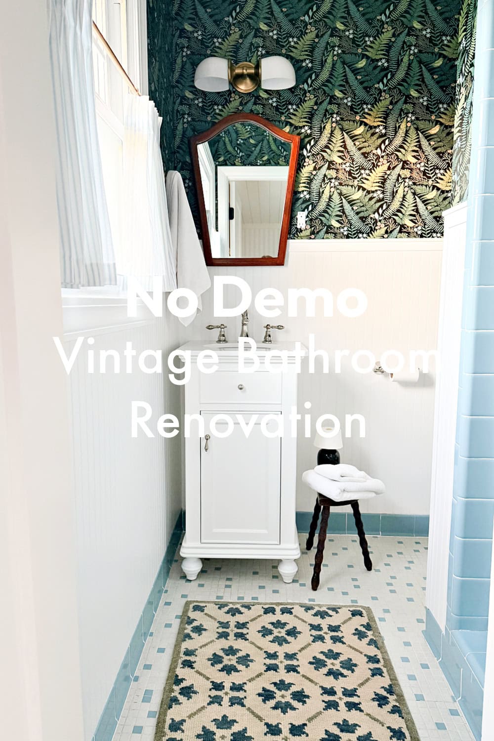 small bathroom with white vanty and large graphic