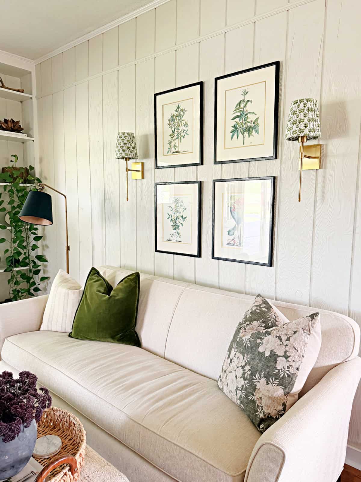living room sofa wall with DIY pleated lampshades on wall sconces